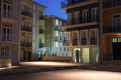 an empty street in an apartment building at night at New Oporto Apartments - Cardosas in Porto