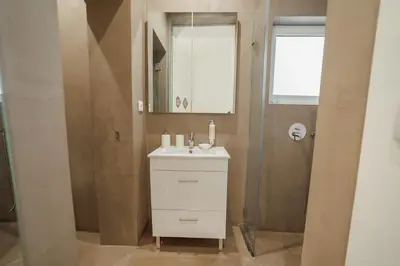 a bathroom with a white sink and a mirror at Downtown Elegant by Hosty in Porto