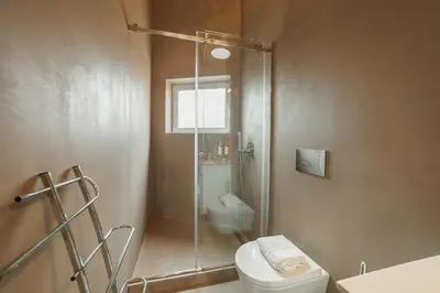 a bathroom with a shower and a toilet and a sink at Downtown Elegant by Hosty in Porto