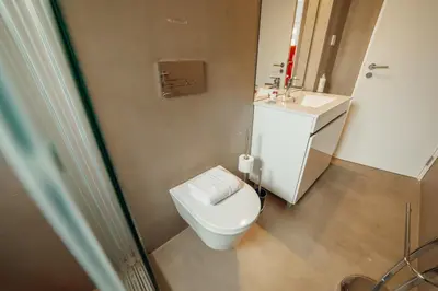 a bathroom with a toilet and a sink at Downtown Elegant by Hosty in Porto