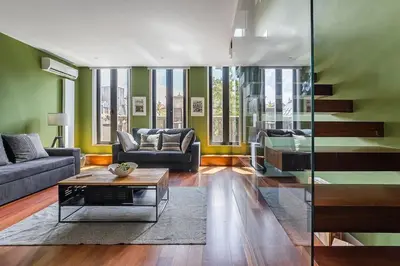 a living room with a couch and a table at City-Center Apartments with Mezzanine and Terrace in Porto