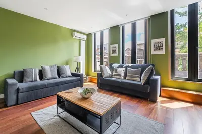 a living room with two couches and a table at City-Center Apartments with Mezzanine and Terrace in Porto