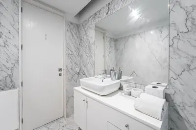 a white bathroom with a sink and a mirror at City-Center Apartments with Mezzanine and Terrace in Porto