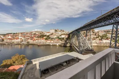 a bridge over a river with a city at Douro's Balcony View - Swimming pool in Vila Nova de Gaia