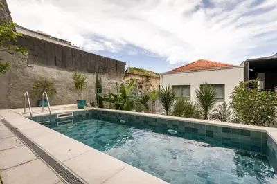 a swimming pool in the backyard of a house at Douro's Balcony View - Swimming pool in Vila Nova de Gaia