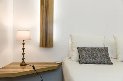 a bedroom with a bed and a table with a lamp at By the River 1 by Porto Dream Stays in Porto