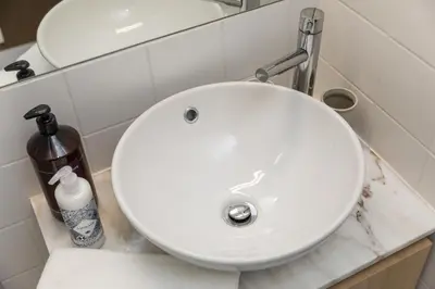 a white sink in a bathroom at By the River 1 by Porto Dream Stays in Porto