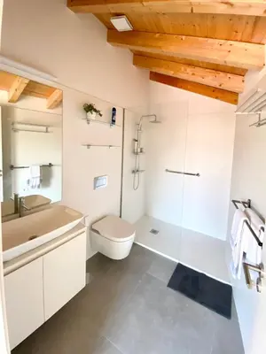 a bathroom with a shower toilet and a sink at VIVA - Rooftop Terrace View Flat in Porto