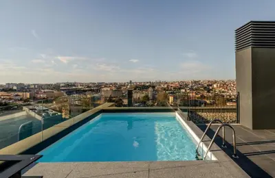 a swimming pool on the roof of a building at New Douro 403 with parking in Vila Nova de Gaia
