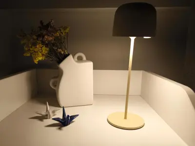a table with a lamp and a vase with flowers at Casa Moara - Downtown Duplex House in Porto