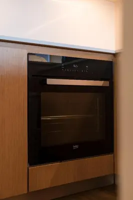 a microwave oven in a cabinet in a room at BEST - Apartment with AC, Parking and Balcony in Porto