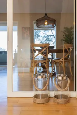 a dining room with a table and chairs and a window at Local 167 - Oporto View House in Vila Nova de Gaia