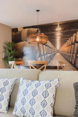 a couch with a pillow in a living room at Local 167 - Oporto View House in Vila Nova de Gaia