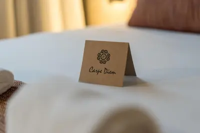 a piece of paper sitting on top of a table at Carpe Diem Porto By Dualgroup in Porto