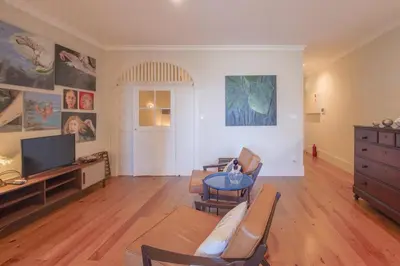 a living room with a couch and a tv at Once Upon in Porto Apartment III in Porto