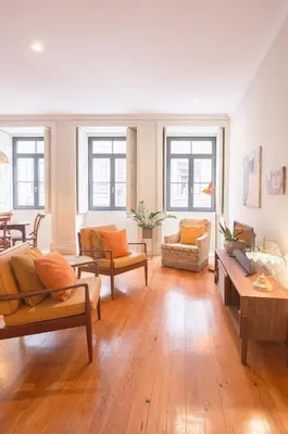 a large living room with wooden floors and furniture at Once Upon in Porto Apartments I in Porto