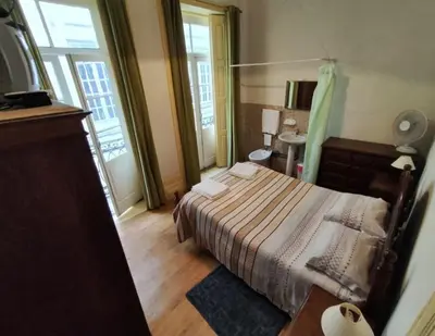a small bedroom with a bed and a bathroom at Porto Chique AL 5 in Porto