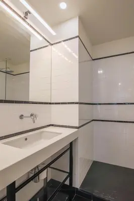 a bathroom with a sink and a mirror at Aliados Living Apartment in Porto