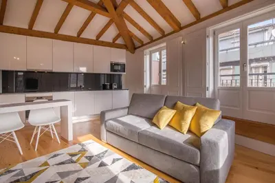 a living room with a couch and a table at Almada Prime Apartment II in Porto