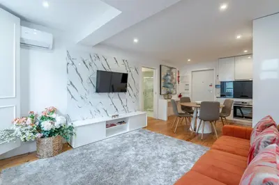 a living room with a couch and a table at Almada Prime III in Porto
