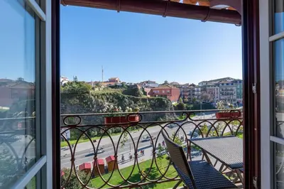 a balcony with a view of a city at Catedral da Sé Apartment in Porto