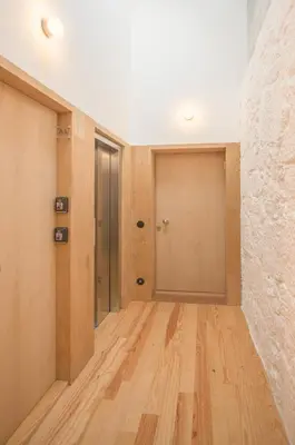 an empty hallway with wood floors and a wall at Charming Blue Apartment in Porto