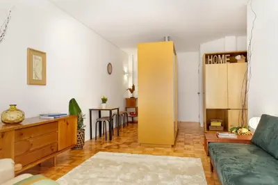 a living room with a couch and a table at VIVA Cozy Downtown in Porto