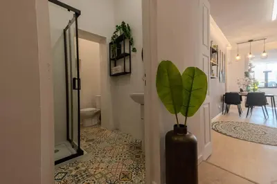 a hallway with a vase with a plant in it at River Sight Corticeira III in Porto