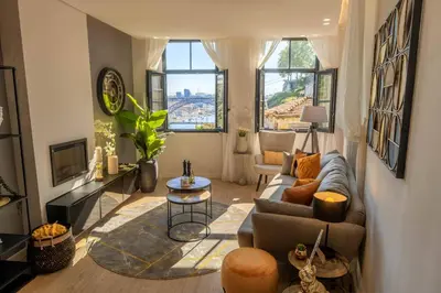 a living room with a couch and a table at River Sight Corticeira III in Porto