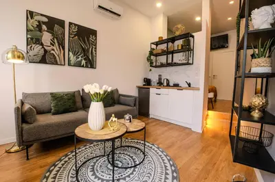 a living room with a couch and a table at River Corticeira I in Porto