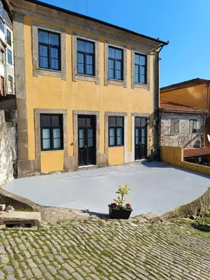 a house with a large driveway in front of it at River Corticeira I in Porto