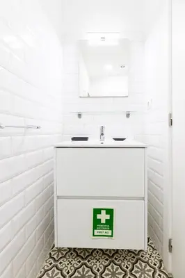 a bathroom with a white vanity and a sink at Trindade Trendy Studio 17 in Porto