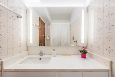 a bathroom with a sink and a tub at GuestReady - Eclectic haven in the heart of Porto in Porto