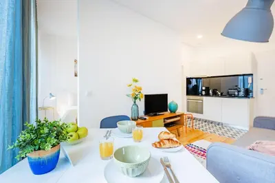 a living room with a couch and a table at Urban Studio @ Bonfim in Porto