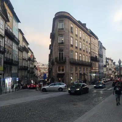 a city street with cars parked on the street at Ribeira Riverview Panoramic in Porto