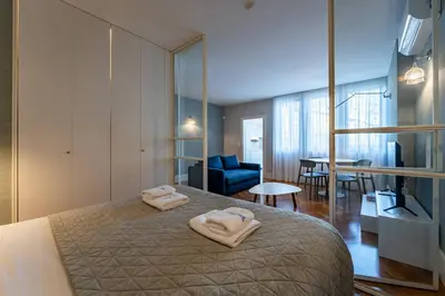 a bedroom with a bed with two towels on it at Intimate Apartment Downtown With Terrace - D in Porto