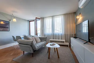 a room with white walls and a door with a mirror at Oporto Chic and Glamorous Downtown with Terrace-F in Porto