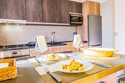 a kitchen with two plates of food on a table at Gaia Riverview in Vila Nova de Gaia