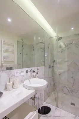 a bathroom with a sink and a shower at Oporto Exquisite Apartment in Porto