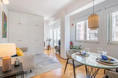 a living room with a table and a couch at PS70 Apartments I in Porto