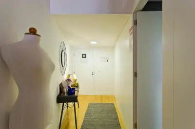 a mannequin standing in a hallway with a door at Ribeira Memories 72 in Porto