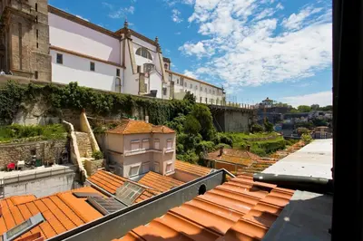 a view from the roof of a building with orange tiled roofs at Ribeira Memories 72 in Porto