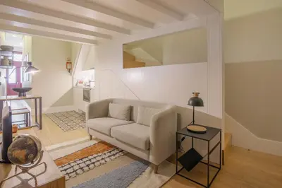 a living room with a couch and a table at Tailor's Apartments II in Porto