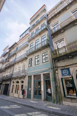 a large building on the side of a street at Virginie Almada Apartment in Porto