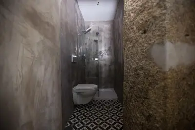 a small bathroom with a shower and a toilet at Porto Vintage Guesthouse in Porto