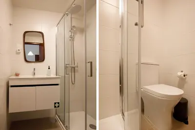 a kitchen with a white refrigerator and a sink at Casa Agustina, Central and sunny Studio with optional Parking in Porto