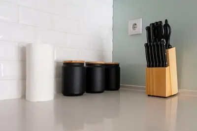 a group of knives in a knife block on the floor at Modern Camões Flat, In the Heart of Porto in Porto