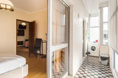 a bathroom with a washer and dryer in a room at GuestReady - Bonfim Cozy Retreat in Porto