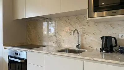 a kitchen with a sink and a microwave at BEST - Studio Trindade with AC and Parking in Porto