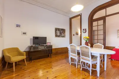 a living room with a table and chairs at Downtown Classic Apartment in Porto